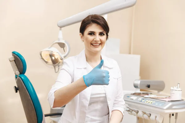 Closeup photo of female doctor in the dentist cabinet.
