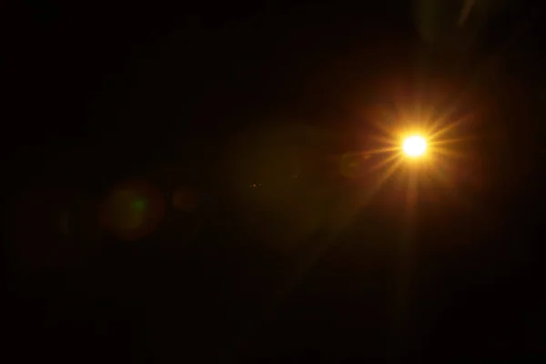 Abstraktes natürliches Sonnenlicht auf der schwarzen Seite — Stockfoto