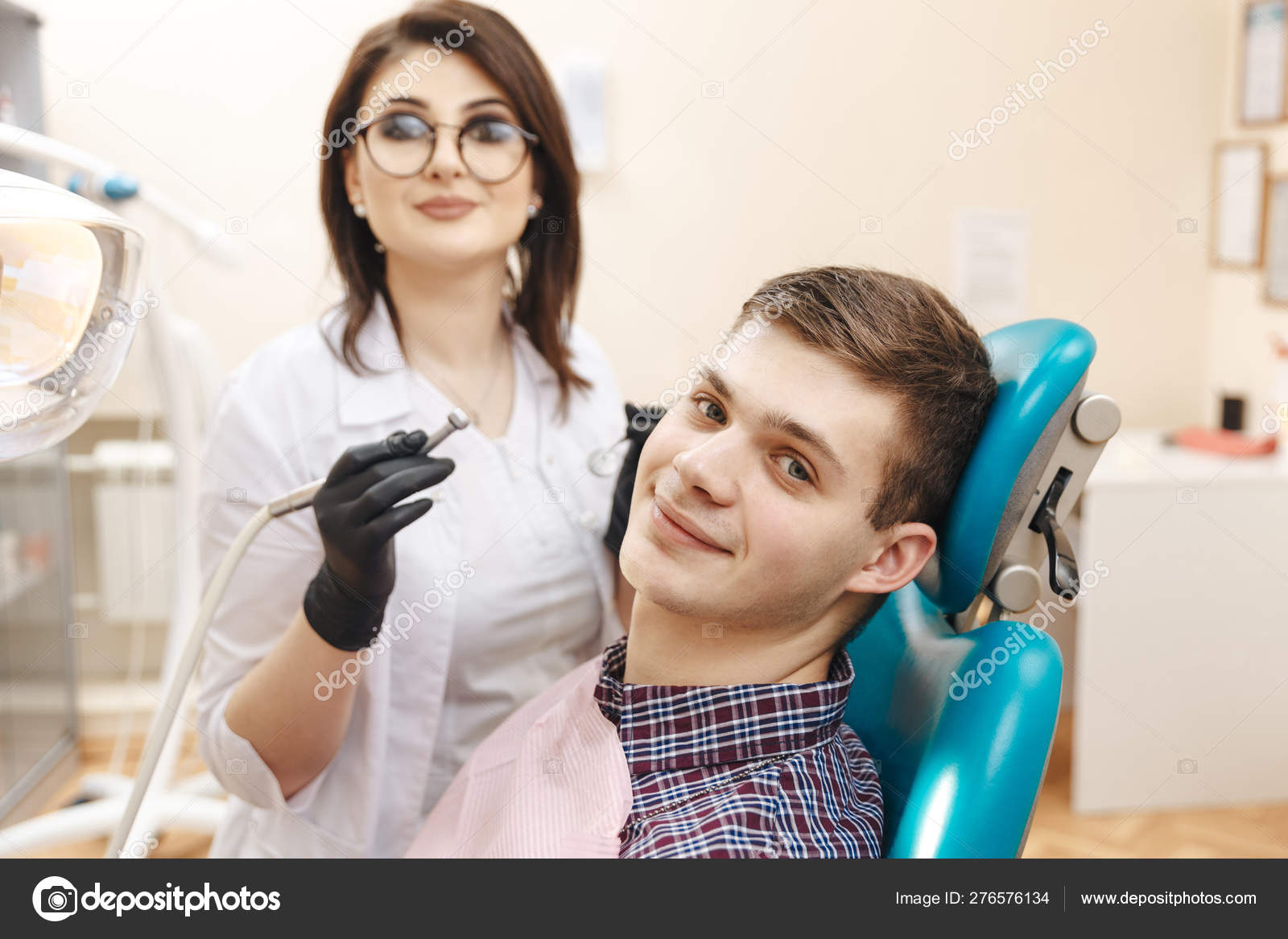 Oral care. Dentist with patient in the dentist room. — Stock Photo © burdun 276576134
