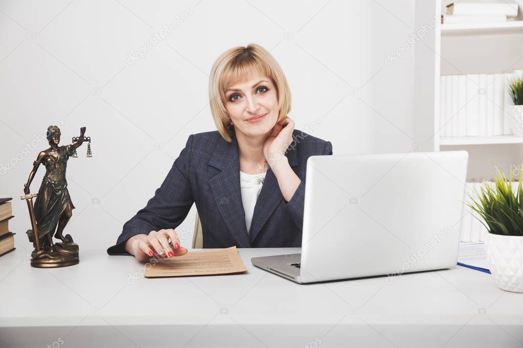 Woman jurist working laptop in office isolated.
