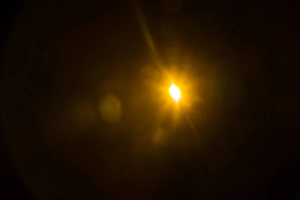 Astratto Sole naturale bagliore sul nero — Foto Stock