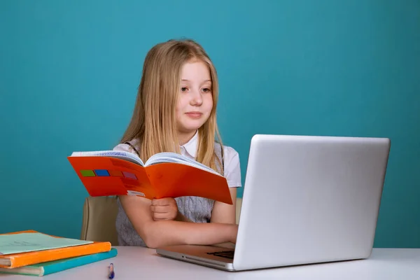 Education and school concept - smiling little student girl with many books at school. — Stock Photo, Image