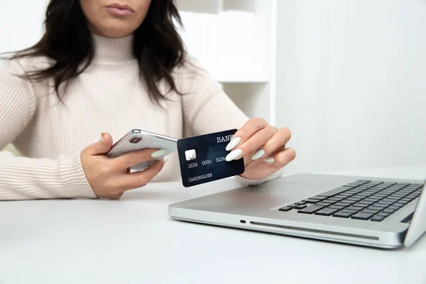 Internet shopping online. Woman with credit card using in to buy things.