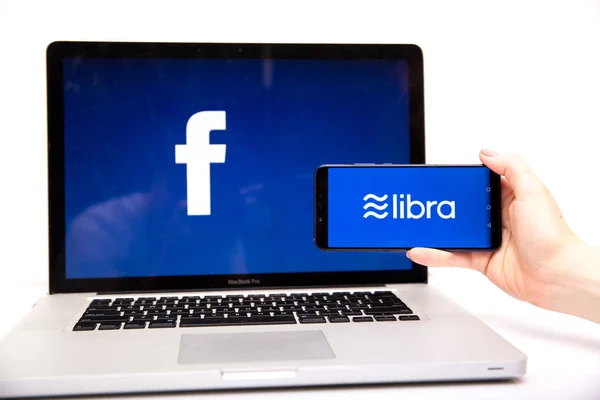 Tula 2.08.2019 Libra Facebook on the phone and computer screen. — Stock Photo, Image