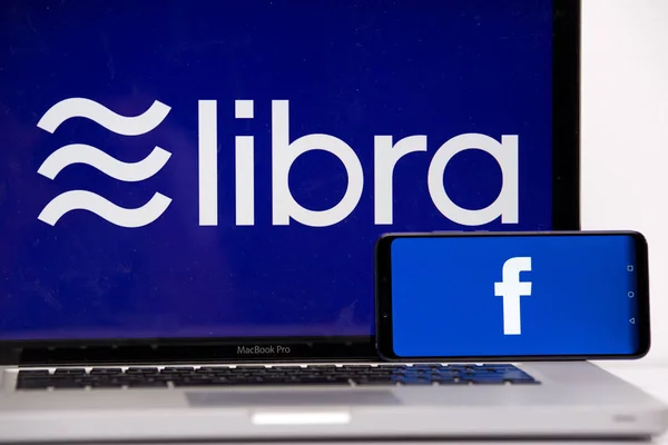 Tula 2.08.2019 Libra Facebook on the phone and computer screen. — Stock Photo, Image