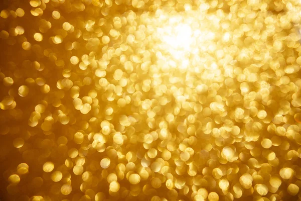 Oro luccicanti luci di Natale. Sfondo astratto offuscato — Foto Stock