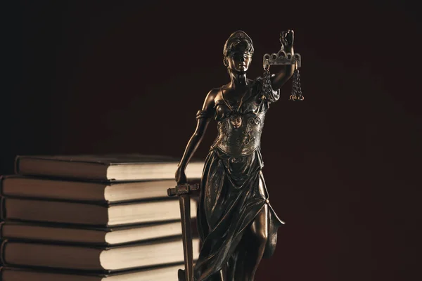 Bronze Statue Of Justice on the desk isolated. Notary concept.