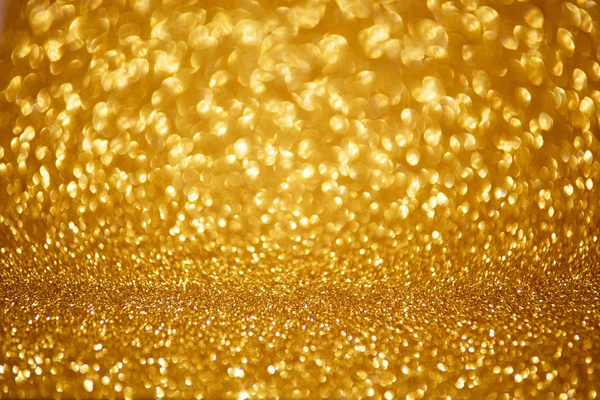 Luzes de Natal brilhantes douradas. Fundo abstrato desfocado — Fotografia de Stock