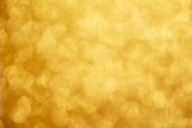 Altın parıldayan noel ışıkları. Bulanık soyut arkaplan