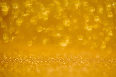 Altın parıldayan noel ışıkları. Bulanık soyut arkaplan