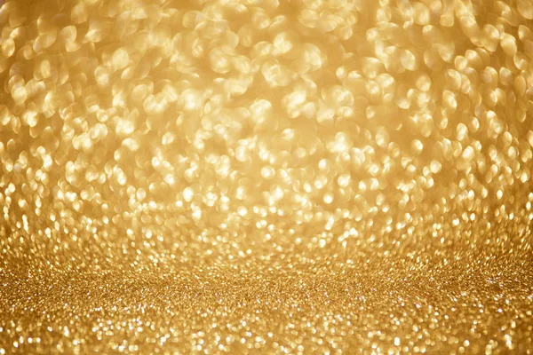 Gouden glanzende kerstverlichting. Wazige abstracte achtergrond — Stockfoto