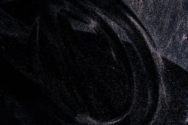 Абстрактний справжній пил, що плаває над чорним тлом для — стокове фото