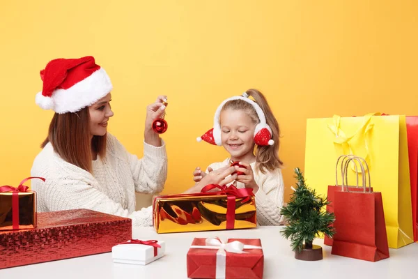Xmas concept. Mother with girl on holiday. Unpacking gifts together. — Stock Photo, Image