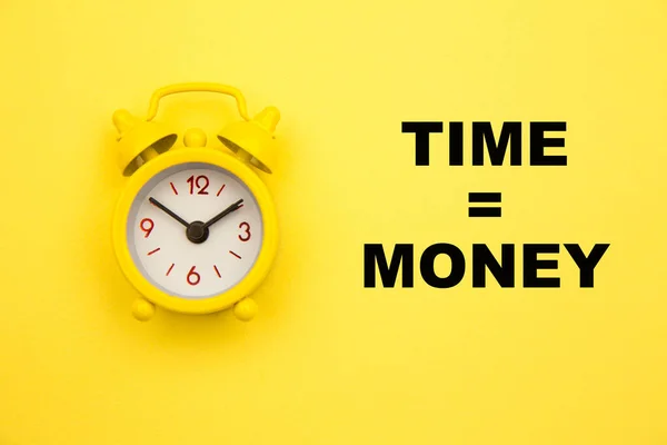 Time is money concept with alarm clock aside on yellow background — Stock Photo, Image