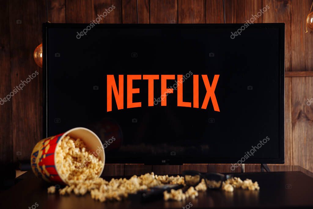 Tula, Russia, 04 May 2020: Netflix on the TV screen. popcorn and glasses