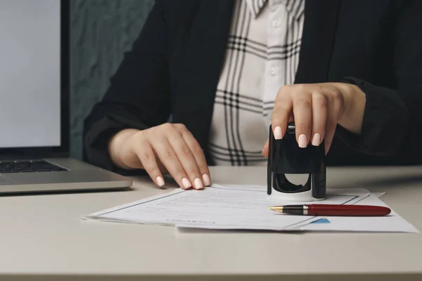 Close up on womans notary public hand stamping the document. Notary public concept — Stock Photo, Image