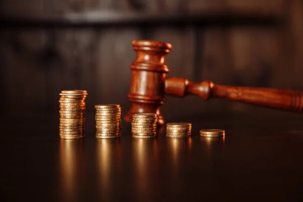 TAX payment concept. Stack of coins with wooden judge gavel. — Stock Photo, Image