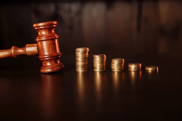 TAX payment concept. Stack of coins with wooden judge gavel. — Stock Photo, Image