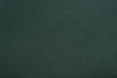 Yoğun koyu yeşil kumaşın dokusu