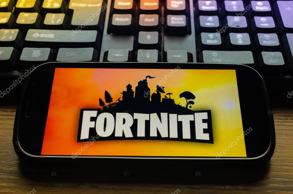 Kostanay, Kazakhstan, January 29, 2019.Mobile phone on the keyboard background, with the logo of the popular game Fortnite from Epic Games.