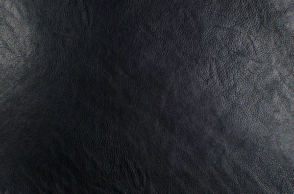 Bakgrund svart läder, abstraktion, textur närbild. — Stockfoto
