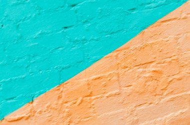 Pembe ve turkuaz çapraz boyalı tuğla duvar arka plan.