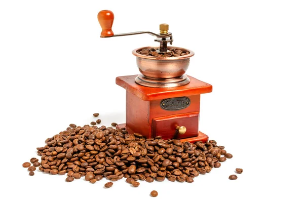 コーヒー豆と白い背景にレトロな木製のコーヒーグラインダー. ロイヤリティフリーのストック写真