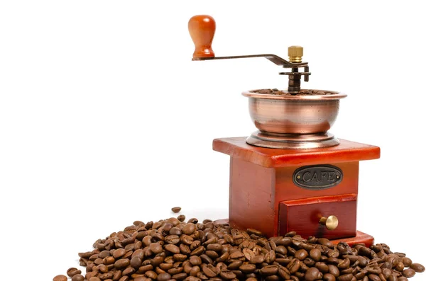 コーヒー豆と白い背景にレトロな木製のコーヒーグラインダー. ストックフォト