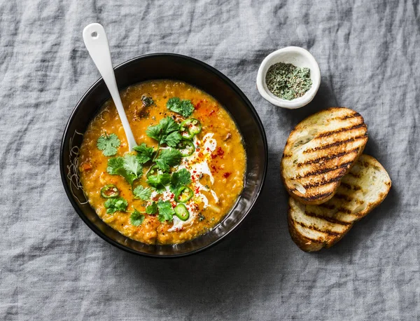 Pureed yellow peas and tomatoes vegetarian soup on grey background, top view — Stock Image Pureed Yellow Peas Tomatoes Vegetarian Soup Grey Background Top View Royalty Free Stock Photos