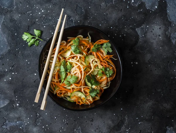 Quickly pickled vegetables carrots, daikon, cucumbers, onions, cilantro salad on a dark background, top view. Banh mi vegetarian salad — Stock Image Quickly Pickled Vegetables Carrots Daikon Cucumbers Onions Cilantro Salad Dark Royalty Free Stock Images