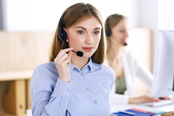 Portrait of call center operator at work. Group of people in a headset ready to help customers. Business concept — Stock Photo, Image