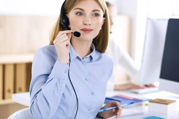 Portrait of call center operator at work. Group of people in a headset ready to help customers. Business concept — Stock Photo, Image