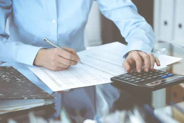 Bookkeeper woman or financial inspector making report, calculating or checking balance, close-up. Business, audit or tax concepts — Stock Photo, Image
