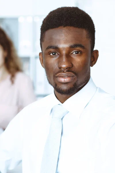 African american businessman at meeting in office, colored in white. Multi ethnic business people group — Stock Photo, Image