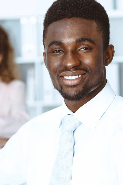 African american businessman at meeting in office, colored in white. Multi ethnic business people group — Stock Photo, Image