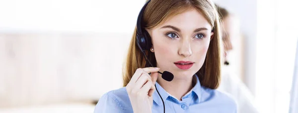 Portrait of call center operator at work. Group of people in a headset ready to help customers. Business concept — Stock Photo, Image