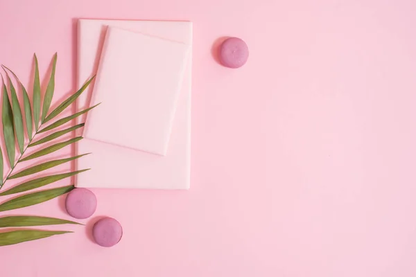 cake macaron, gift or present box and flower on pink table from above. Beautiful breakfast. Flat lay style, copy spase