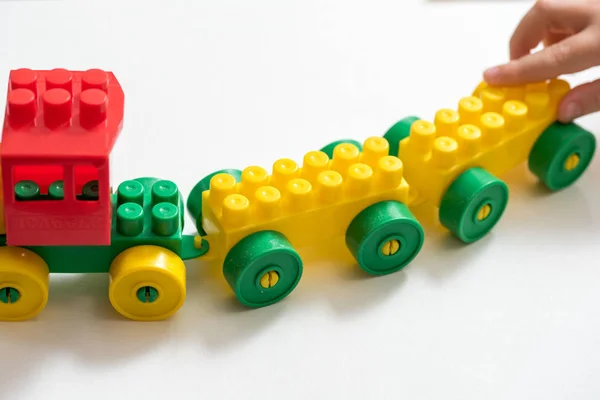 Toy Color Designer Train Child Plays Builds Out Cubes Hands — Stock Photo, Image