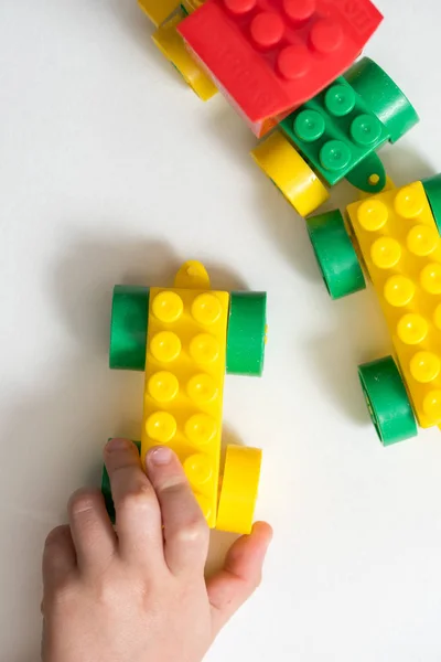 Toy Color Designer Train Child Plays Builds Out Cubes Hands — Stock Photo, Image