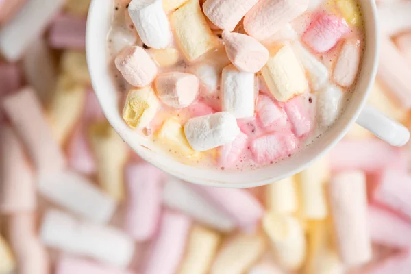 Cocoa drink with much marshmallow background, top view