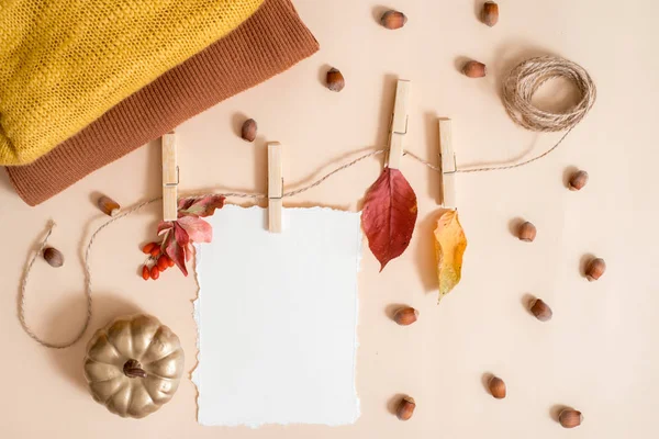 Autumn leaf composition, notebook. Dry bright leaves, nuts. knitted yellow warm scarf, golden pumpkin. The concept of cozy autumn. greeting card. Trend torn Paper. Flat lay, top view. copy space. — Stock Photo, Image