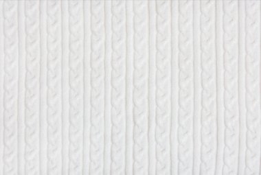 Beyaz örgü kumaş dokusu. El yapımı örgü..