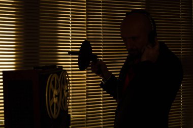 A secret KGB agent overhears and tapes an important conversation.