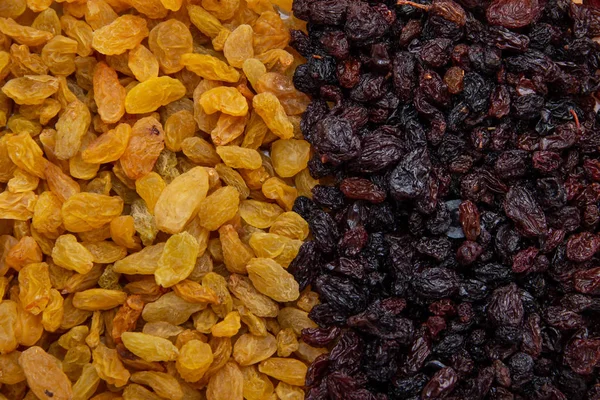 Abundance of raisins, yellow and red dried grapes, vegetarianism and healthy food