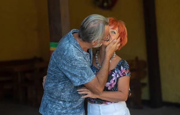 Older couple kissing each other, family values, true love
