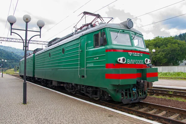 Russian electric Locomotive, train, railway station in the mountains