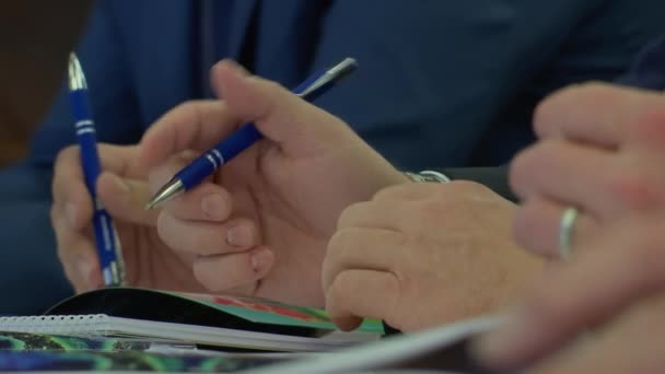 Meeting Businessmen Holding Pens Hands Discussion Close — Stock Video