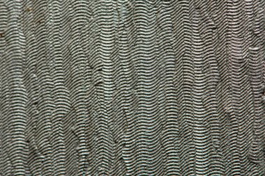 Yükseltilmiş çizgileri ve çizgileri olan gri duvar kağıdı dokusu