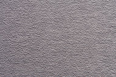 Beton duvarın dokusu, inşaat alçısıyla kaplı, pürüzlü yüzey..