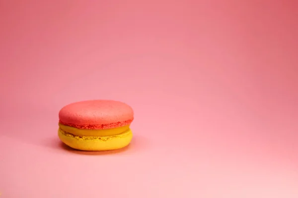 Bright food photography of macroons on pink background